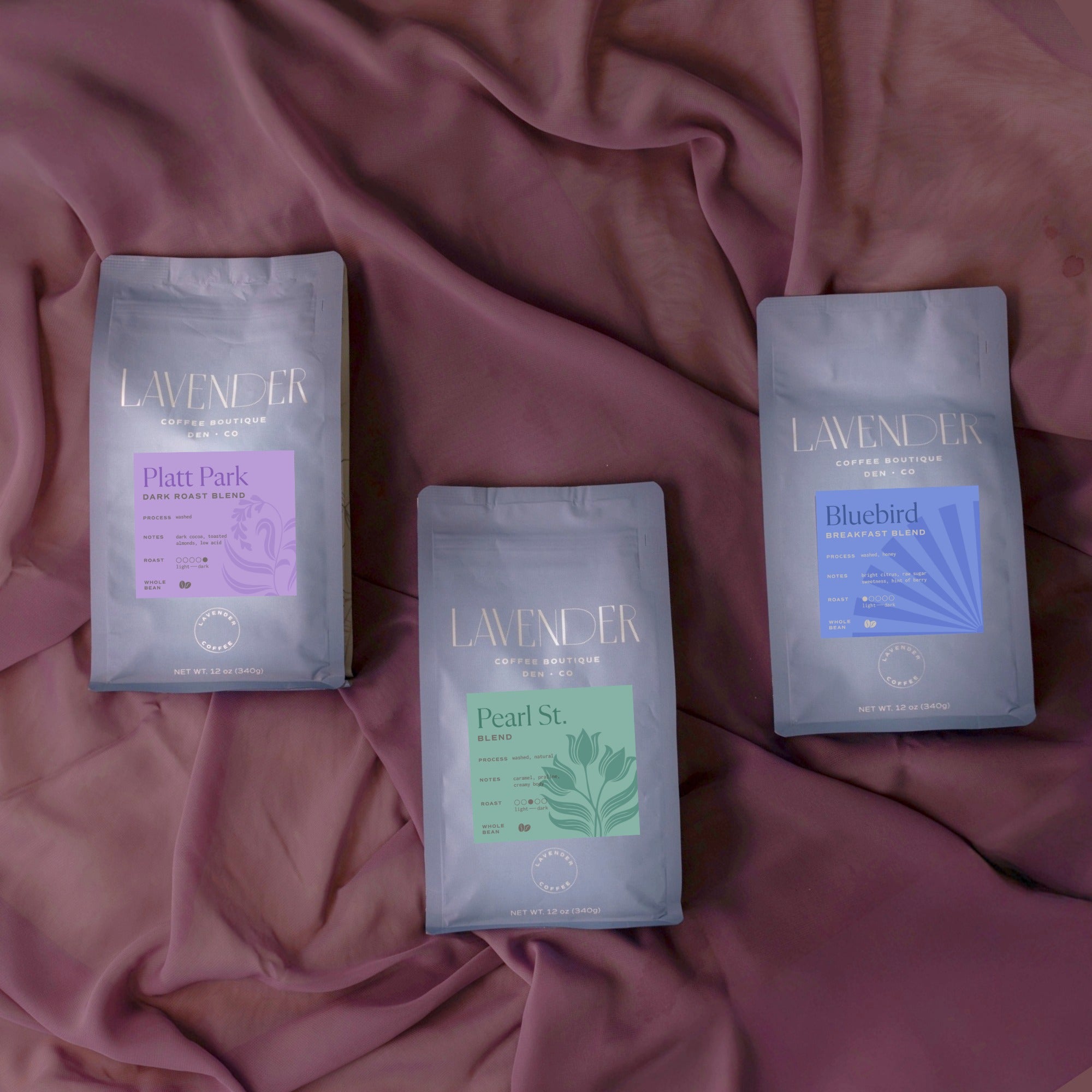 Lavender Coffee Boutique signature small batch mold free coffee roasts. The Platt Park, Pearl St and Bluebird blends.