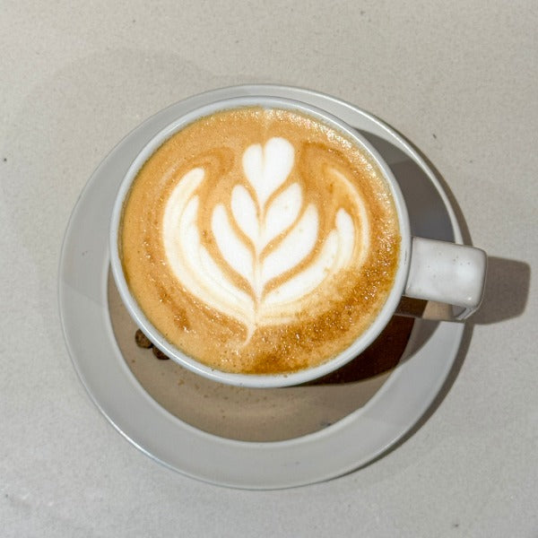 Fireside Latte with maple syrup, warming spices, and latte art from a Denver boutique coffee roaster