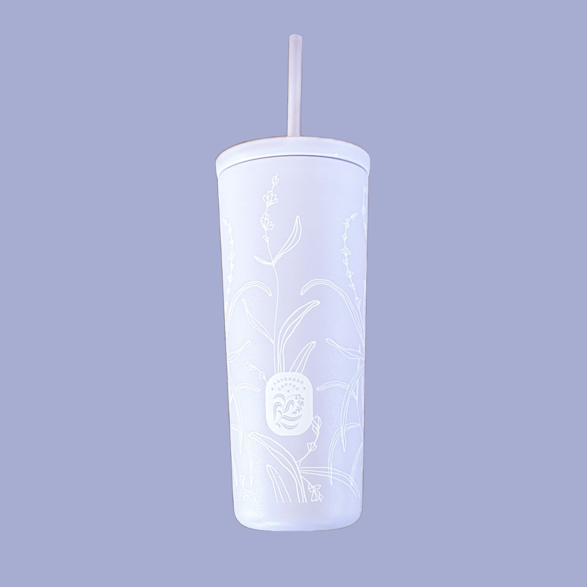 Purple tumbler with floral design and straw on a light purple background