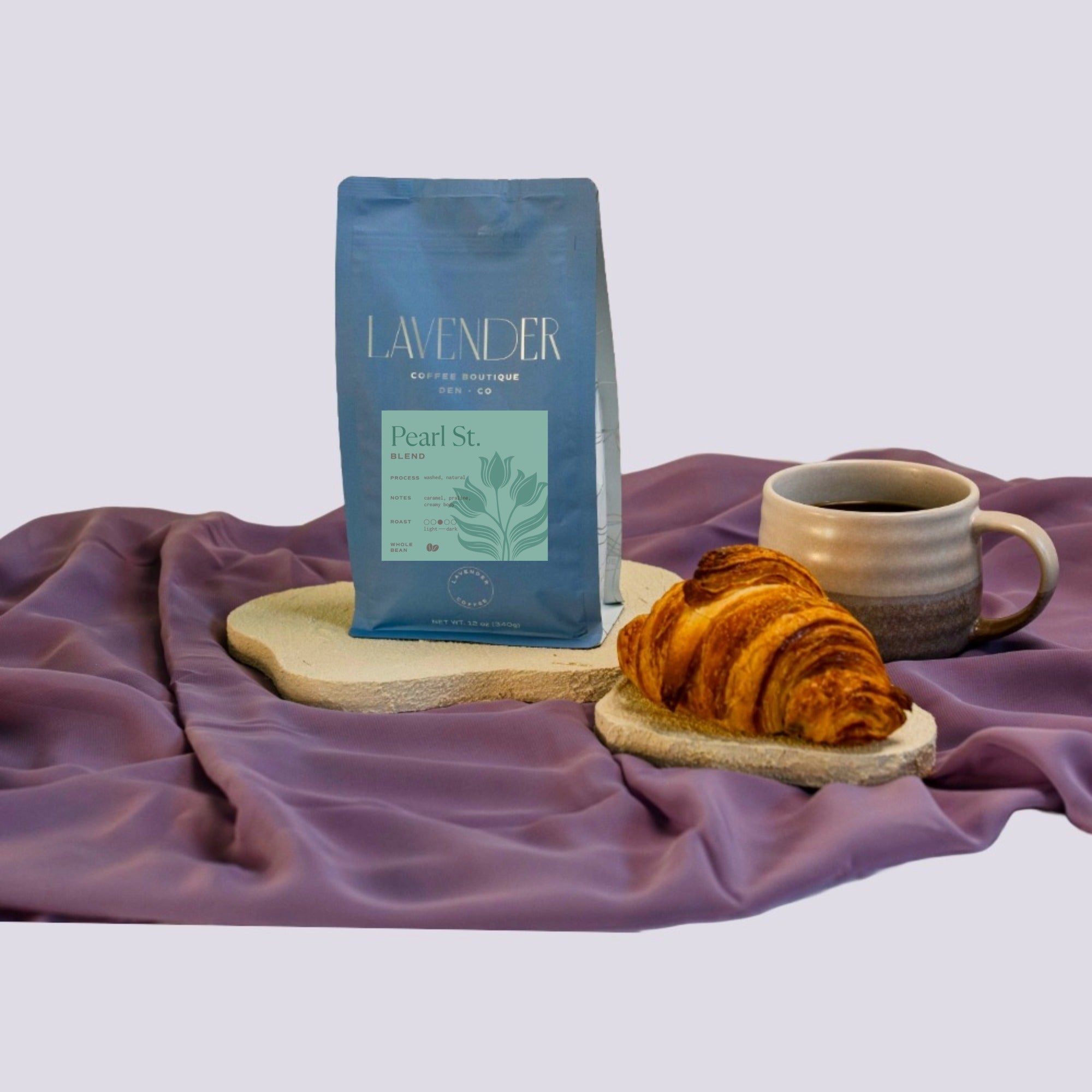 Lavender Coffee Boutique Pearl St house blend coffee with a croissant. A mold free, gentle acidity coffee for a gut friendly cup.